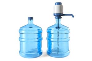 Two large water jugs with dispenser pump