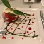 Caprese salad with basil, mozzarella, tomato, balsamic drizzle.