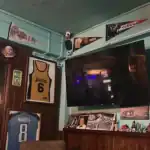 Sports memorabilia displayed in bar corner