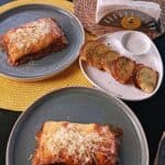 Cheesy lasagna served with crispy garlic bread.