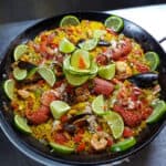 Seafood paella with lime and vegetables.