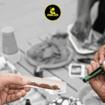 Hands rolling cigarette with grinder nearby, High Life logo.