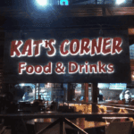 Kat's Corner restaurant sign at night