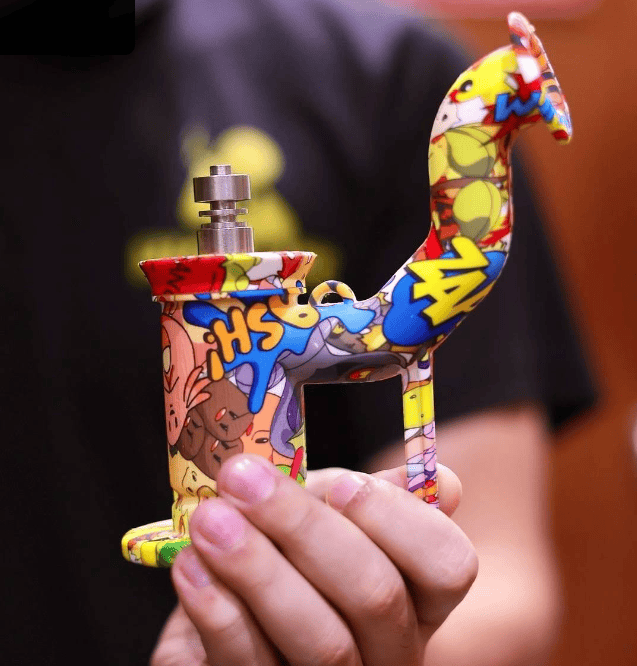 Colorful cartoon-themed vape device in hand.