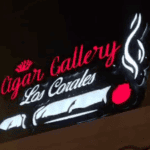 Cigar Gallery Los Corales neon sign at night.