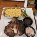 Barbecue pork, mac and cheese, coleslaw on platter.