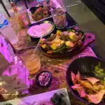 Mexican food assortment with tortillas and rice on table.