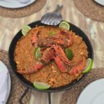 Lobster rice with lime in black pan