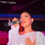 Singer performing at Terra Negra Nights event.