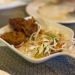 Delicious spicy fritters with fresh vegetable salad